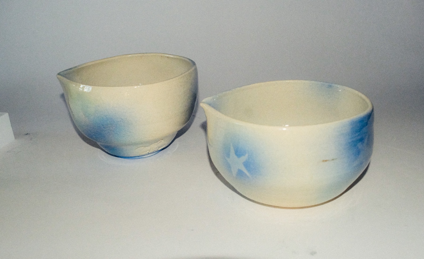 Second styled group of cups and bowls with a bamboo whisk